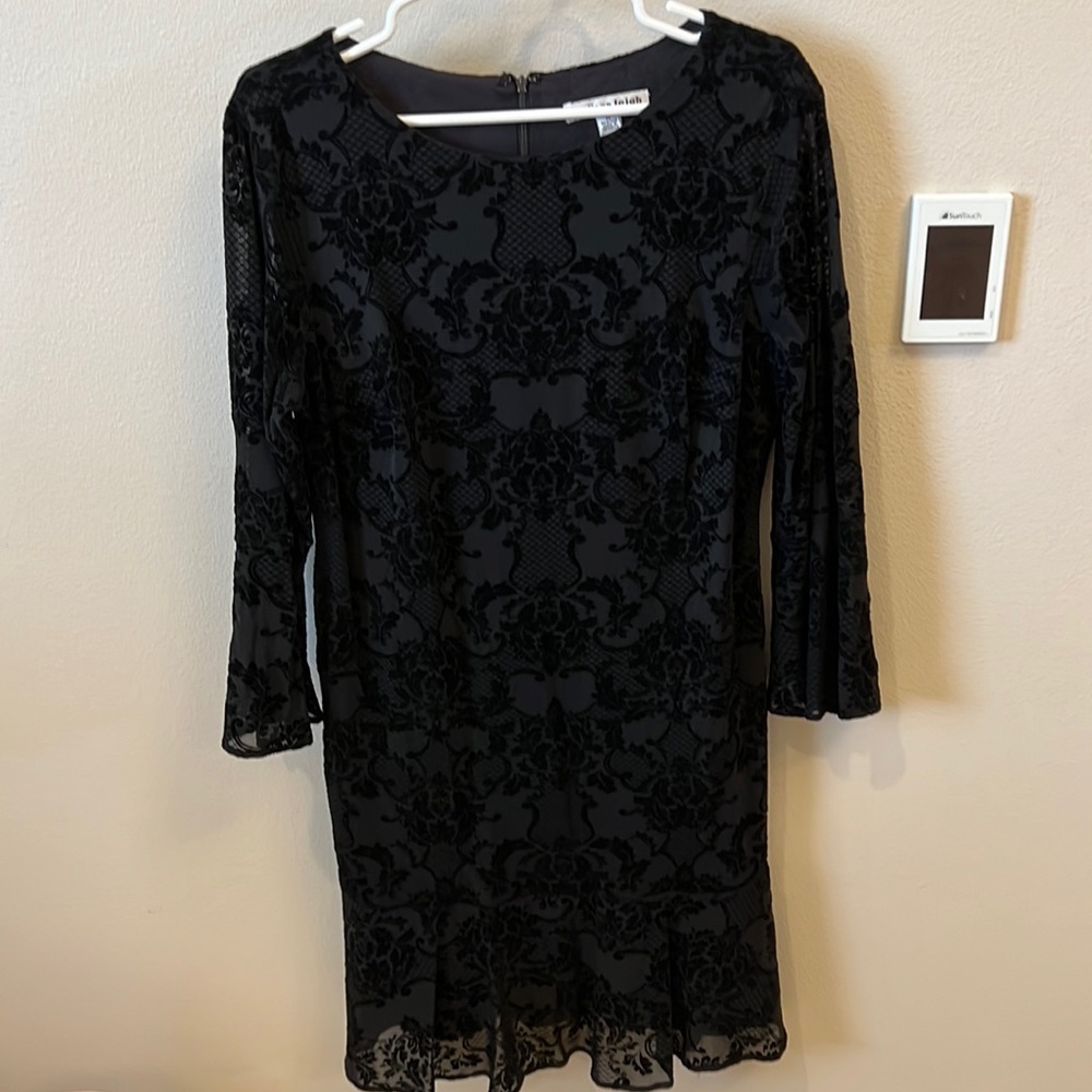 Beautiful velvety lined black dress with sheer bell sleeves. Size 14